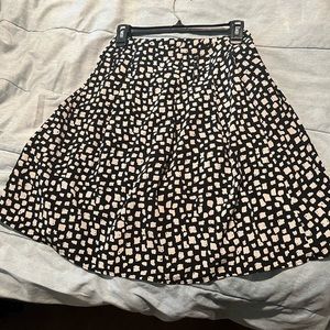 Black with white spots skirt with belt.